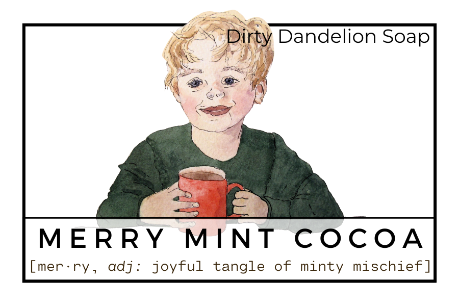 Illustrated soap label for Merry Mint Cocoa featuring a smiling child holding a red mug, framed in black with the Dirty Dandelion Soap name and the definition text describing a joyful, minty scent profile